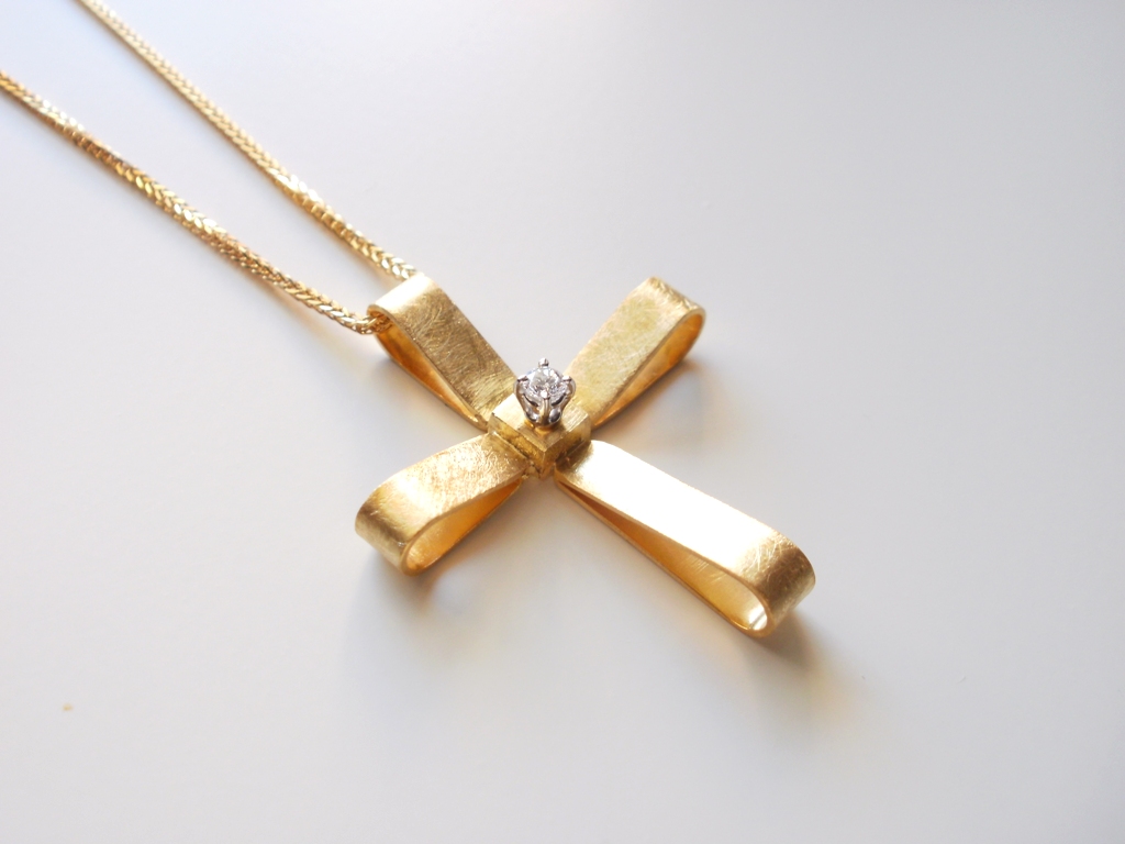 Welcome baby gifts and christening crosses in gold and diamonds, by Katerina Chrysoglou. You can choose the color or gold and the precious stones you like.