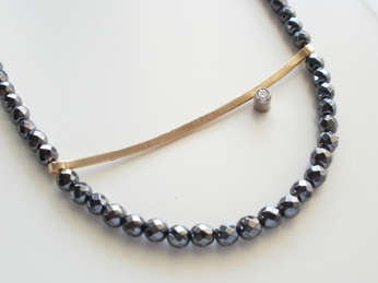Necklace with hematite, goldplated silver, zircon.